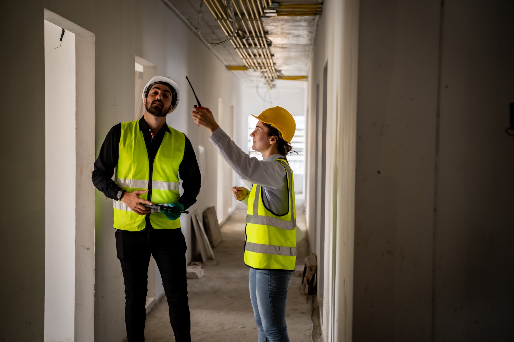 Engineer inspect building structure technicians looking at analyzing unfinished construction project